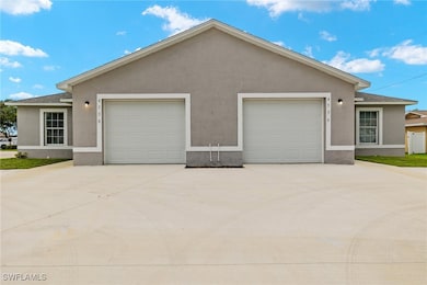 View of front facade featuring stucco siding, conc