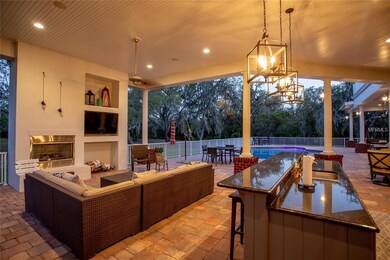 Outdoor kitchen and entertainment area with firepl