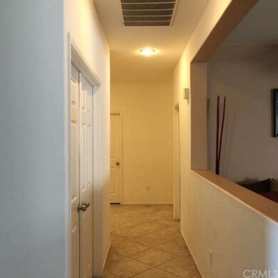 Hallway that leads to bedrooms and garage.