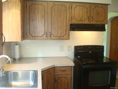 Fully applianced kitchen with ceramic tile backspl