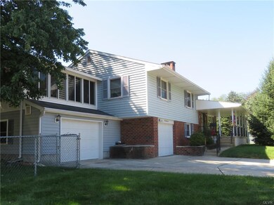 Front view showing 2 separate garages (one oversiz