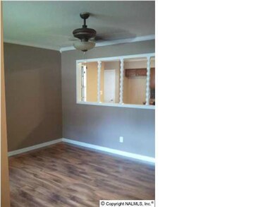 View of Great Room. New wood floors. Open area to kitchen from great room.
