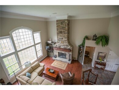Refinished floor-to-ceiling stone fireplace with a
