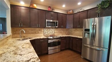 Fully equipped kitchen with granite countertops an