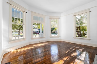 Hallway featuring decorative columns, crown moldin