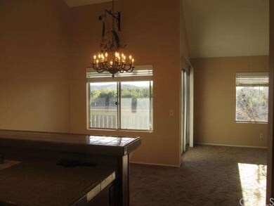Across the kitchen, view out diging room window or
