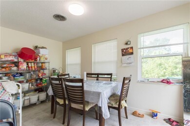The lanai dining area has windows and is under air