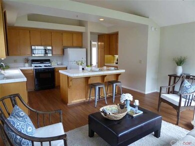 Family Room off kitchen with high ceilings and doo