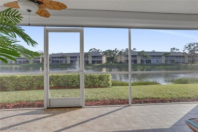 Sunroom / solarium featuring a water view, ceiling