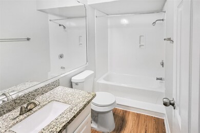 This full bath offers a shower/tub combo, designat
