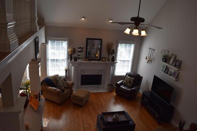 This beautiful Family room has soaring ceilings & a gas fireplace.