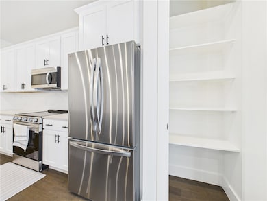 Kitchen featuring appliances with stainless steel