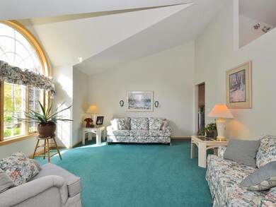 The formal living room overlooks the great landsca