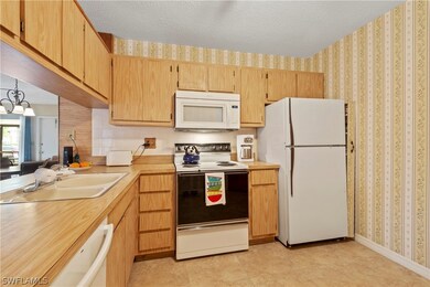 The kitchen has plenty of cabinet space.