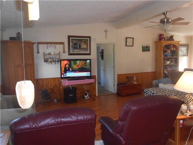 Living room with bay windows. New Laminate Floors installed in 2010.