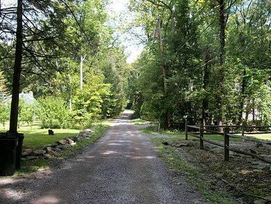 Exterior Front. Gravel road