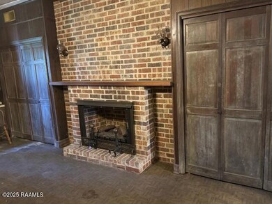 Den on slab with fireplace