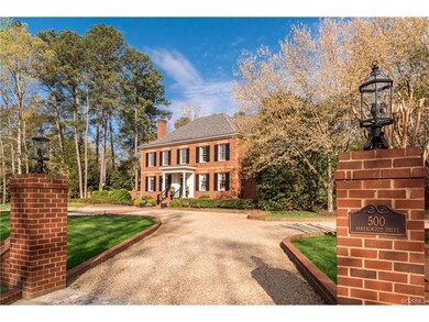 Two car wide circular driveway consists of paver s