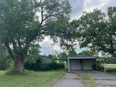 Garage with a garage and driveway