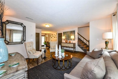 Living room featuring hardwood / wood-style floori