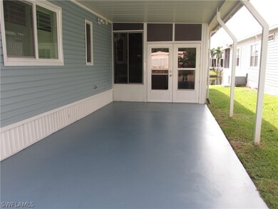 Carport and lanai entrance.