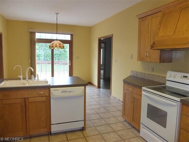 Fully applianced kitchen is open to the dinette.