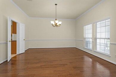 To the right of the entry is a huge formal dining
