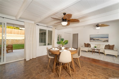 Dining area and living area. Sliding glass door leading out to lanai area and backyard.