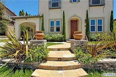 Professionally hardscaped front yard give this hou
