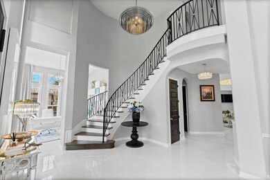 Stunning 2 Story entry way with gorgeous lighting!