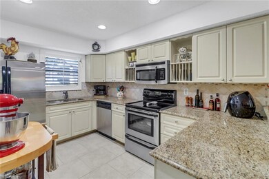 Kitchen featuring granite counters, sink, decorati