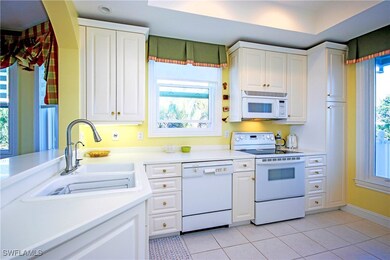 Kitchen featuring light tiled patterned floors, wh