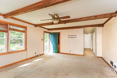 Living room, front door and hallway to bedrooms