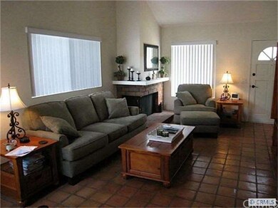 Formal living room with paver flooring, fireplace,