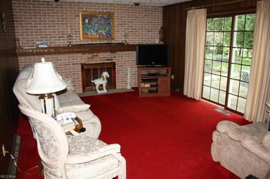 Full brick wall fireplace in Family room. Slider o