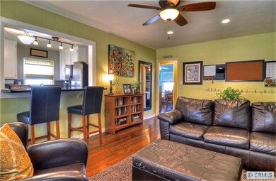 Great room. Notice the refinished original hardwoo