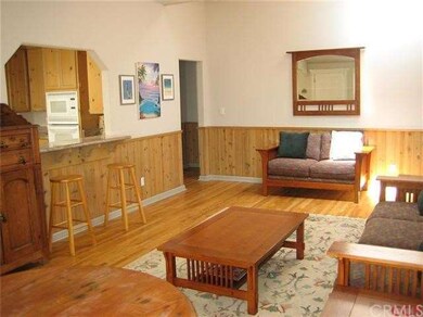 Open living room with pass through to kitchen, has