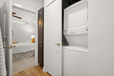 Laundry area featuring stacked washer / drying ma