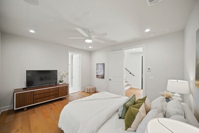 Bedroom features high ceilings, creating an open a