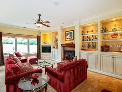 Family room with builtins and view of golf course