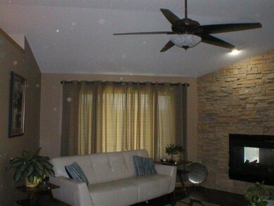 Living room with new wood laminate flooring.  Bolt