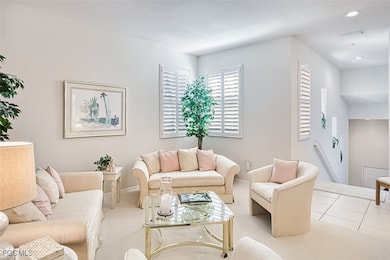 Living room featuring carpet flooring and recessed lighting