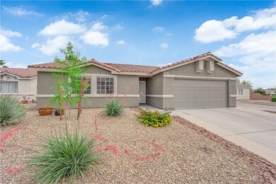 Ranch-style home featuring stucco siding, a tile r