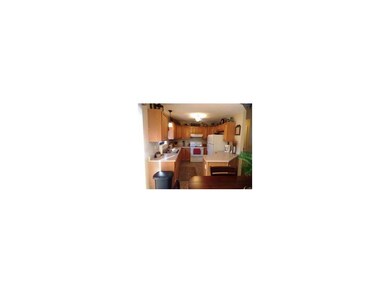 Tiled kitchen is complete with all appliances