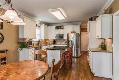 Kitchen with granite counter tops, some stainless 