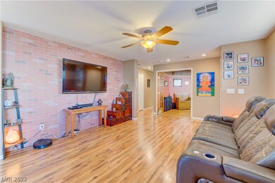 LIVING ROOM WITH ATTENTION GRABBING FAUX BRICK WAL