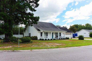 View of front of property featuring a garage, a fr