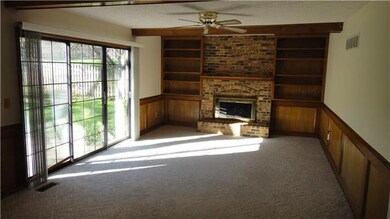 Living Room with Fireplace and Built In Shelves