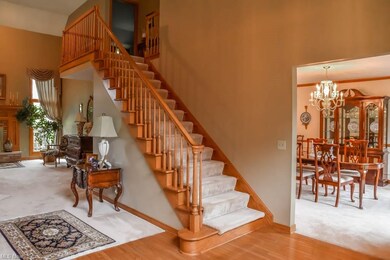 2-story foyer with hardwood floors.