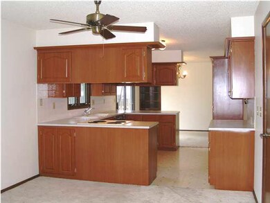 The kitchen as seen from the main floor family roo